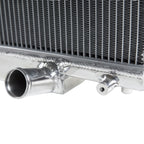 Close-up of a metallic radiator with pipes on a white background
