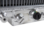 Close-up of a metallic radiator with control knobs on a white background