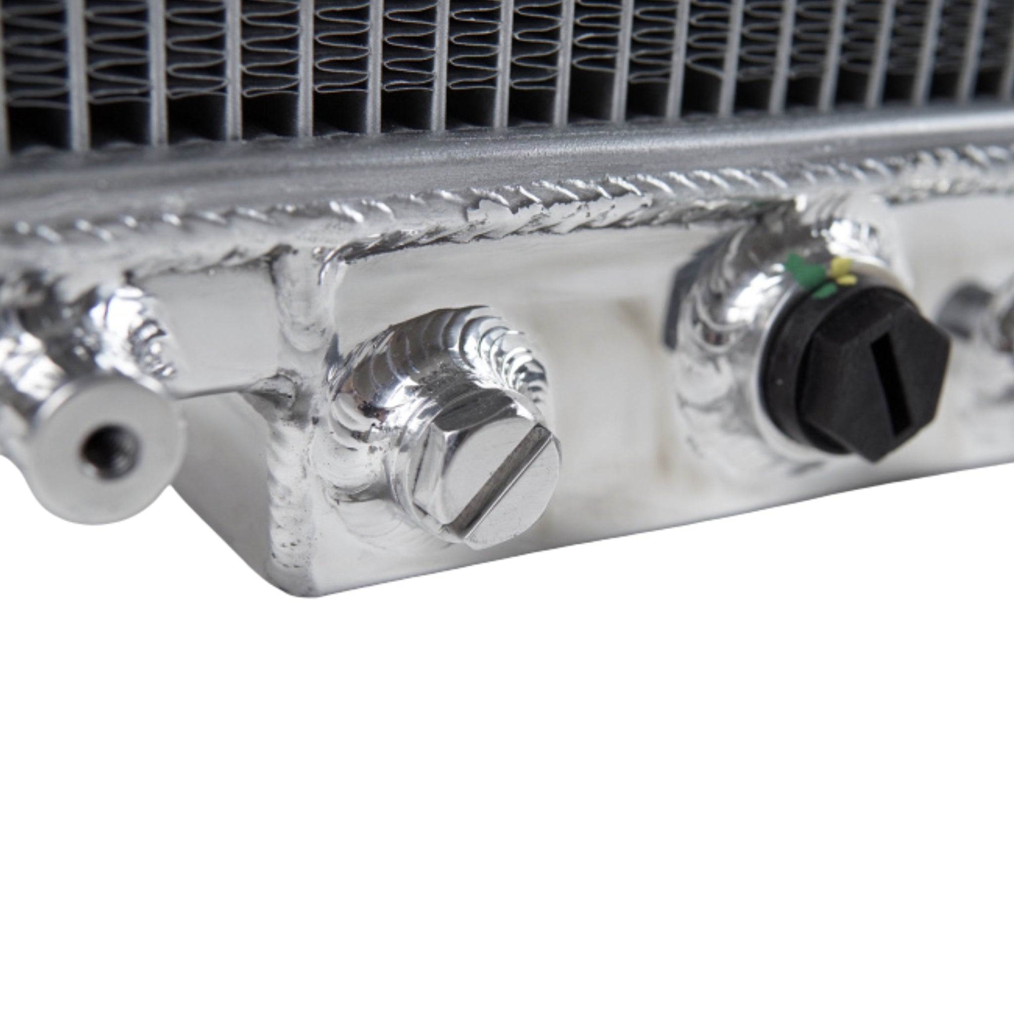Close-up of a metallic radiator with control knobs on a white background