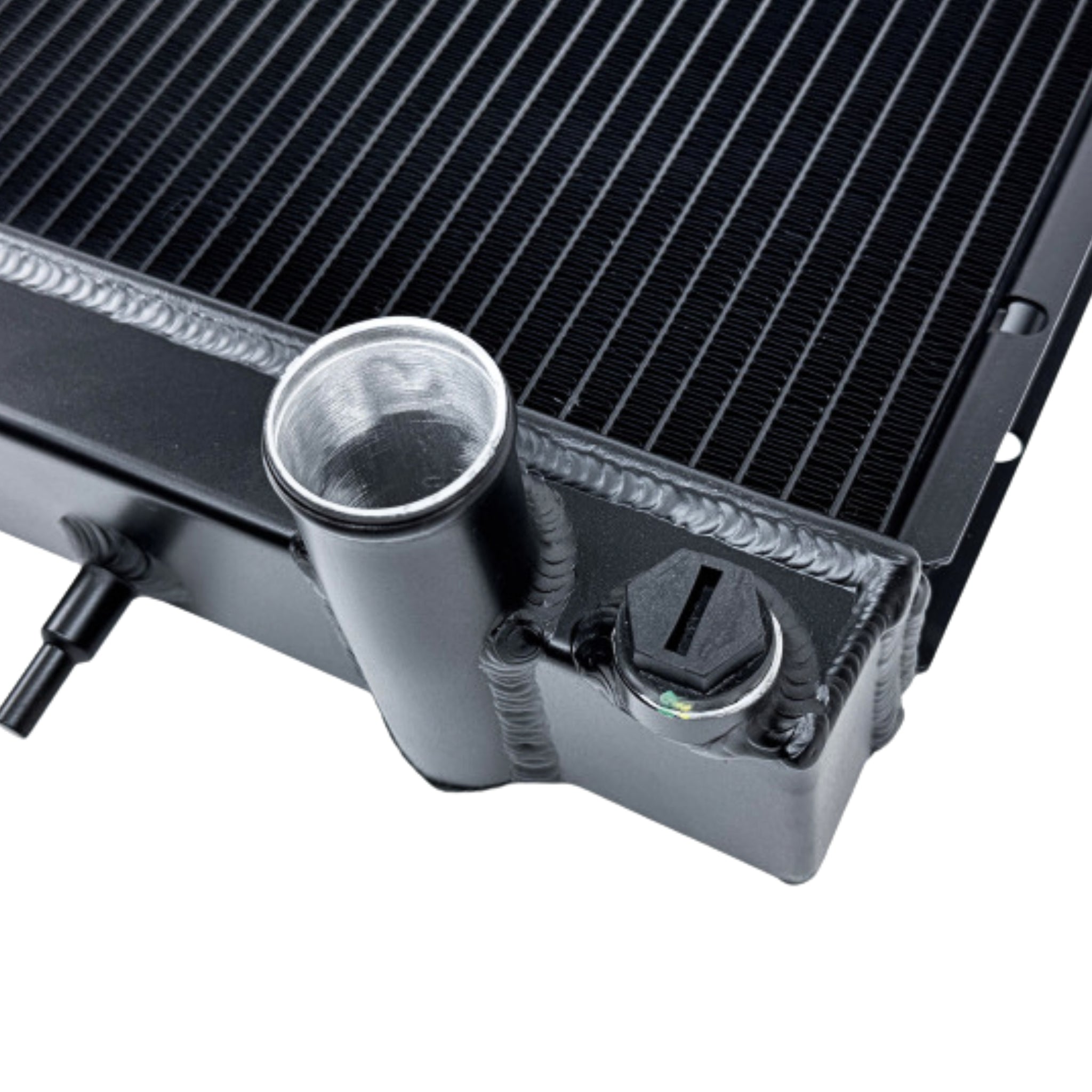 Close-up of a black radiator with metallic components on a white background