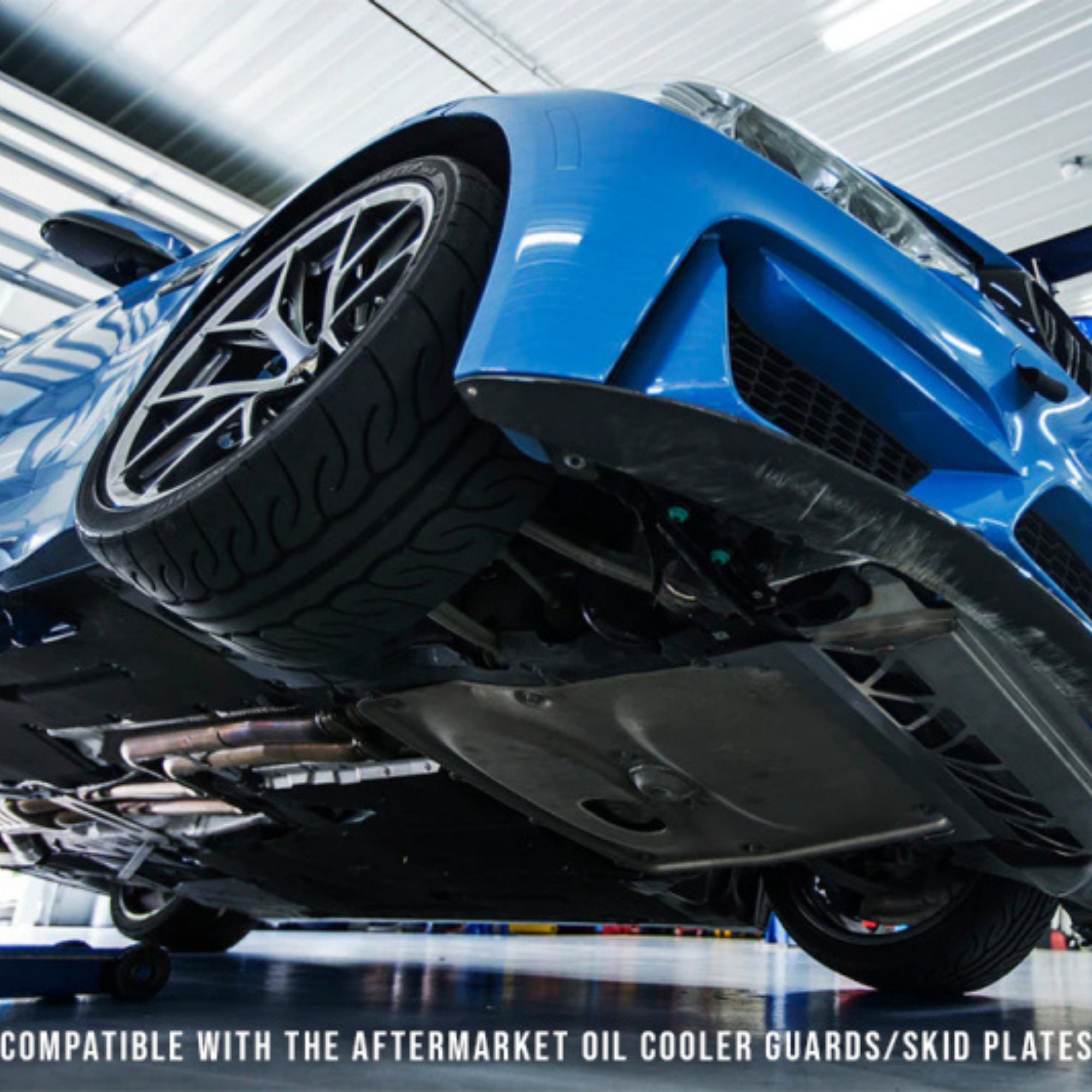 BMW Blue car elevated on a lift in a garage