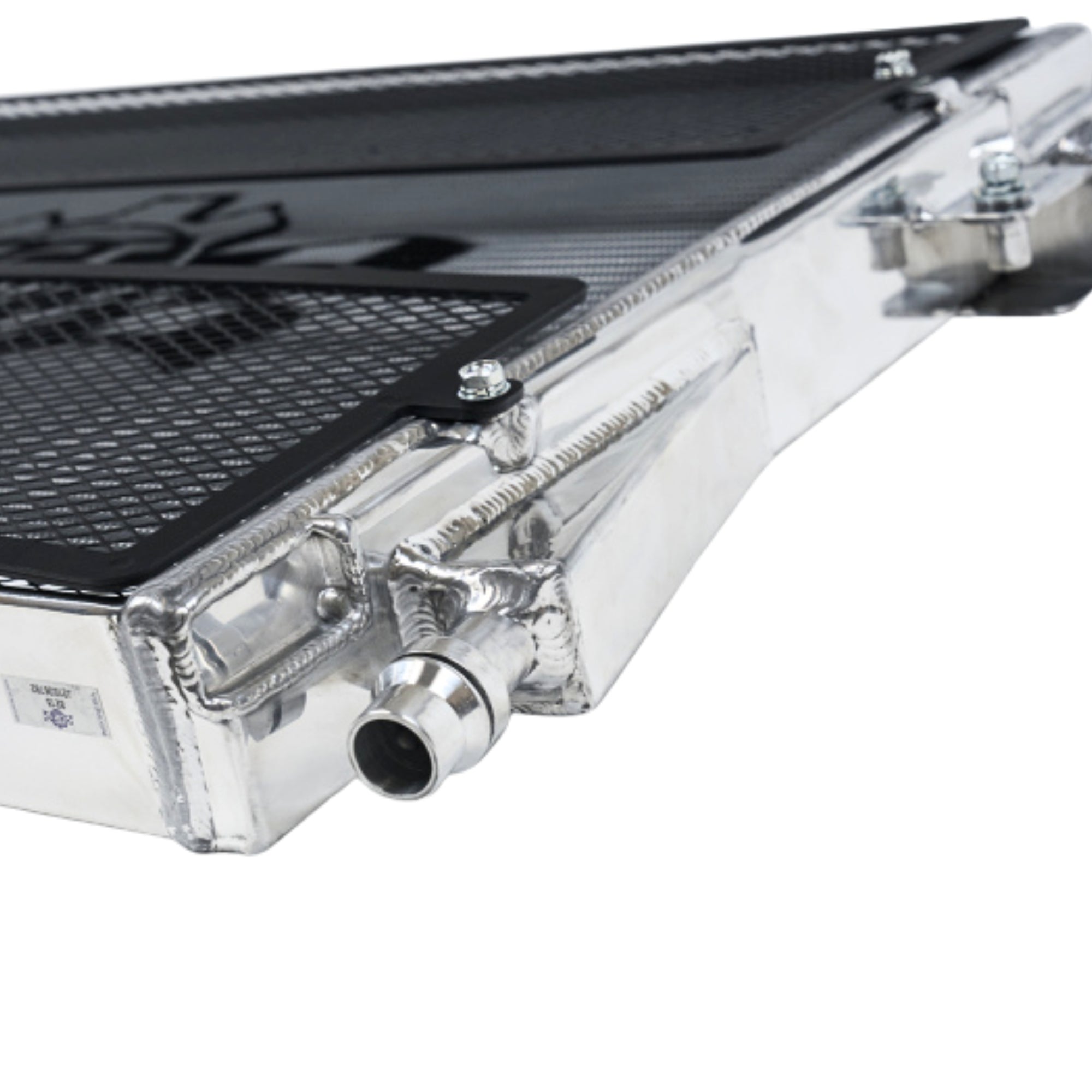 Close-up of a car radiator with metallic finish on a white background for BMW M4