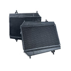 Two black metal radiators on a white background
