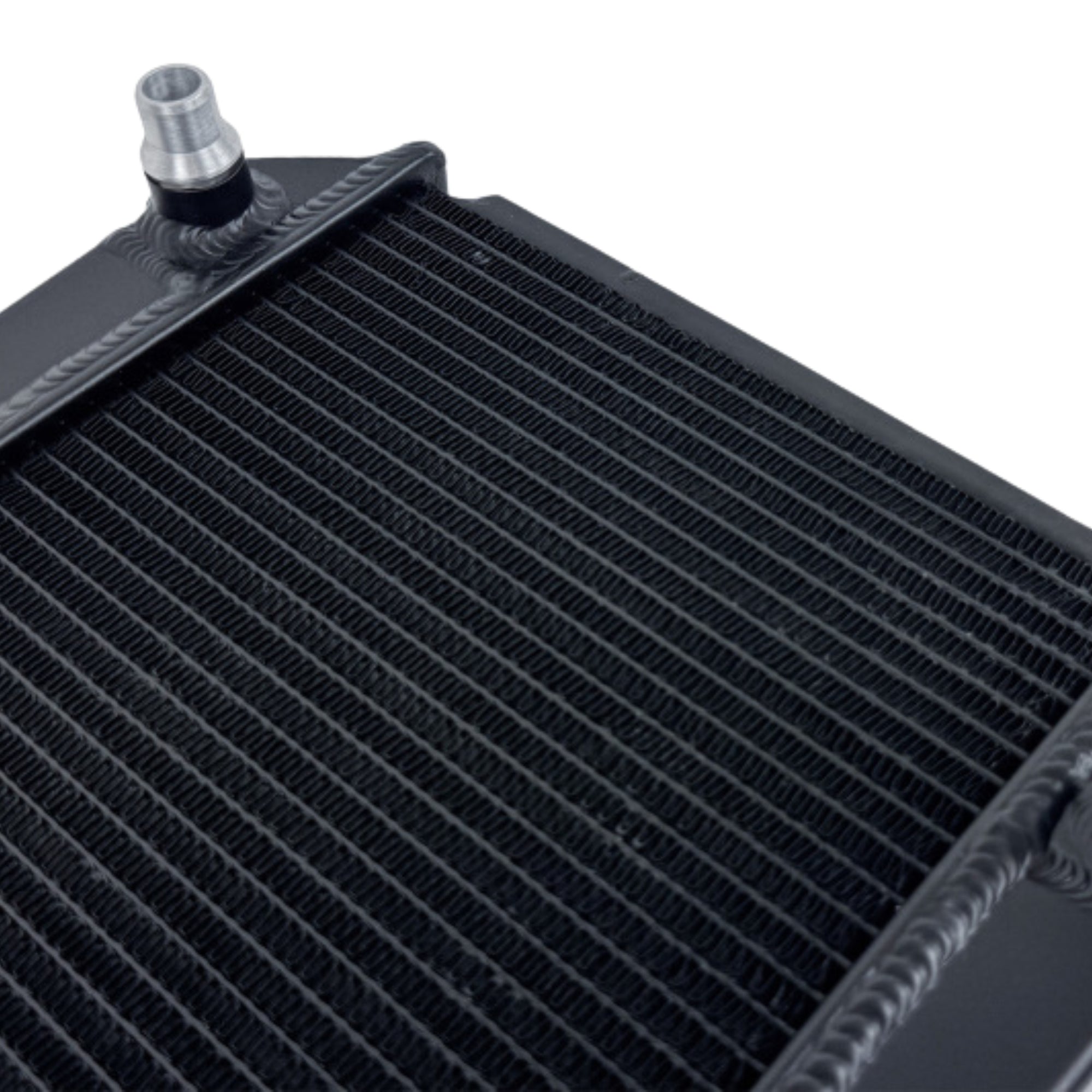 Close-up of a black radiator with a silver fitting on a white background