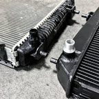 Close-up of two automotive radiators on a concrete surface