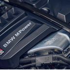 Close-up of a BMW M Power engine with visible branding.