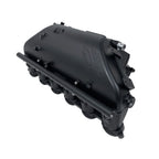 Black automotive manifold cover on a white background