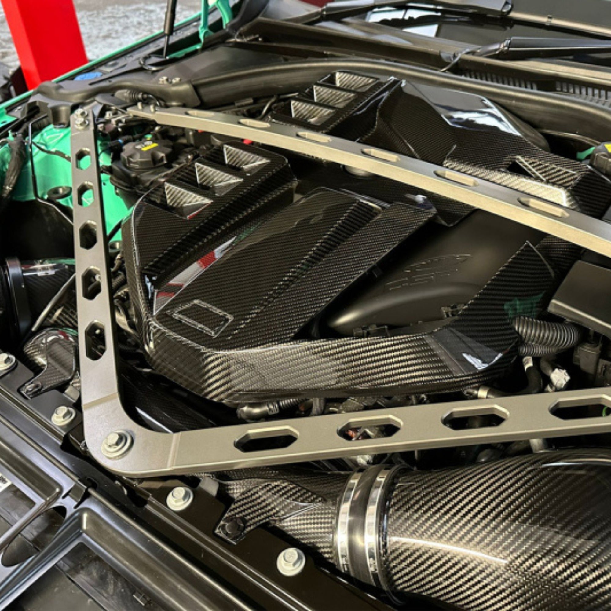 Close-up of a car engine with carbon fiber components