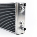 Metallic heat exchanger with inlets on a white background