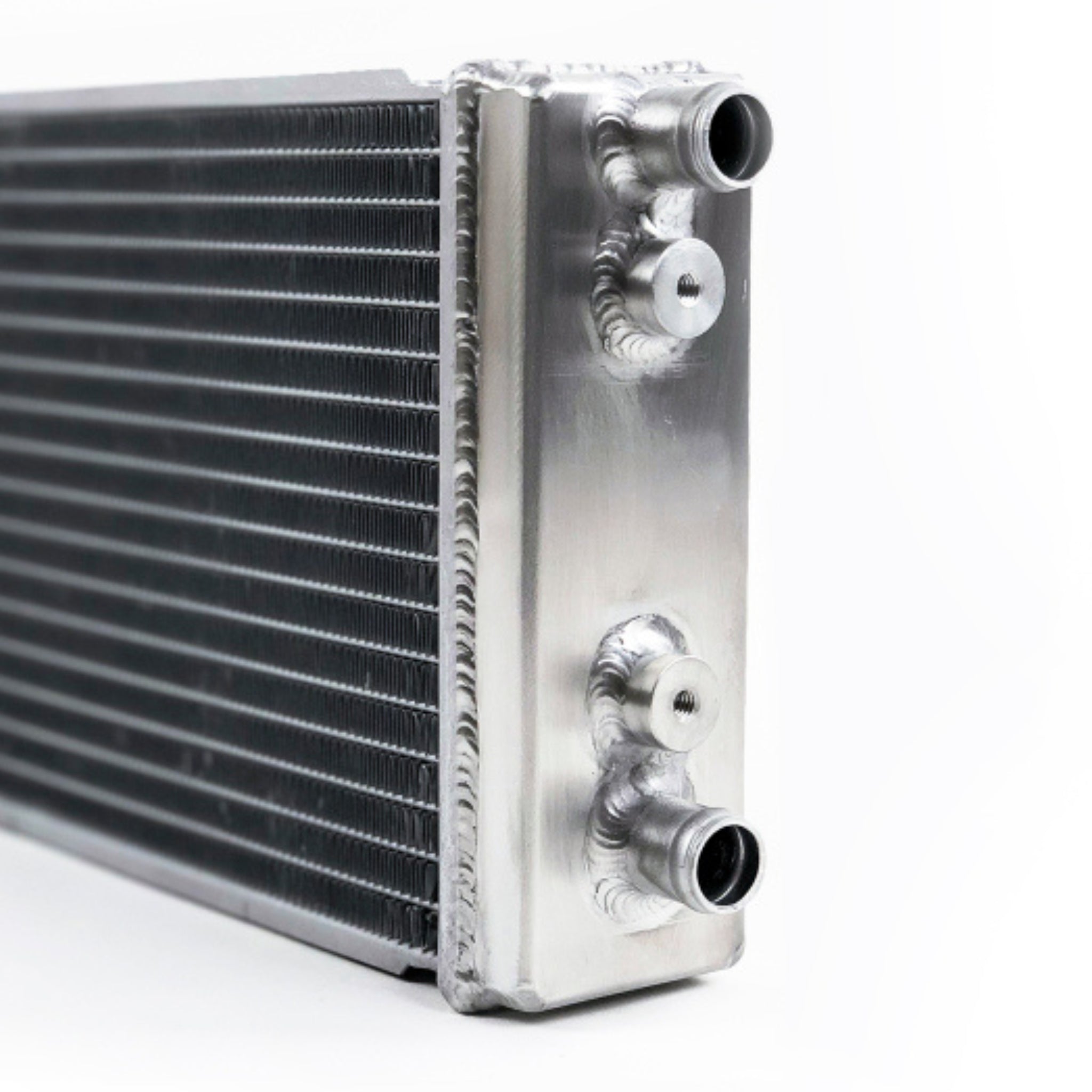 Metallic heat exchanger with inlets on a white background