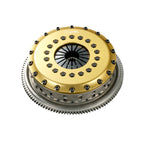 Silvia Clutch disc with gold and silver metallic finish on a white background