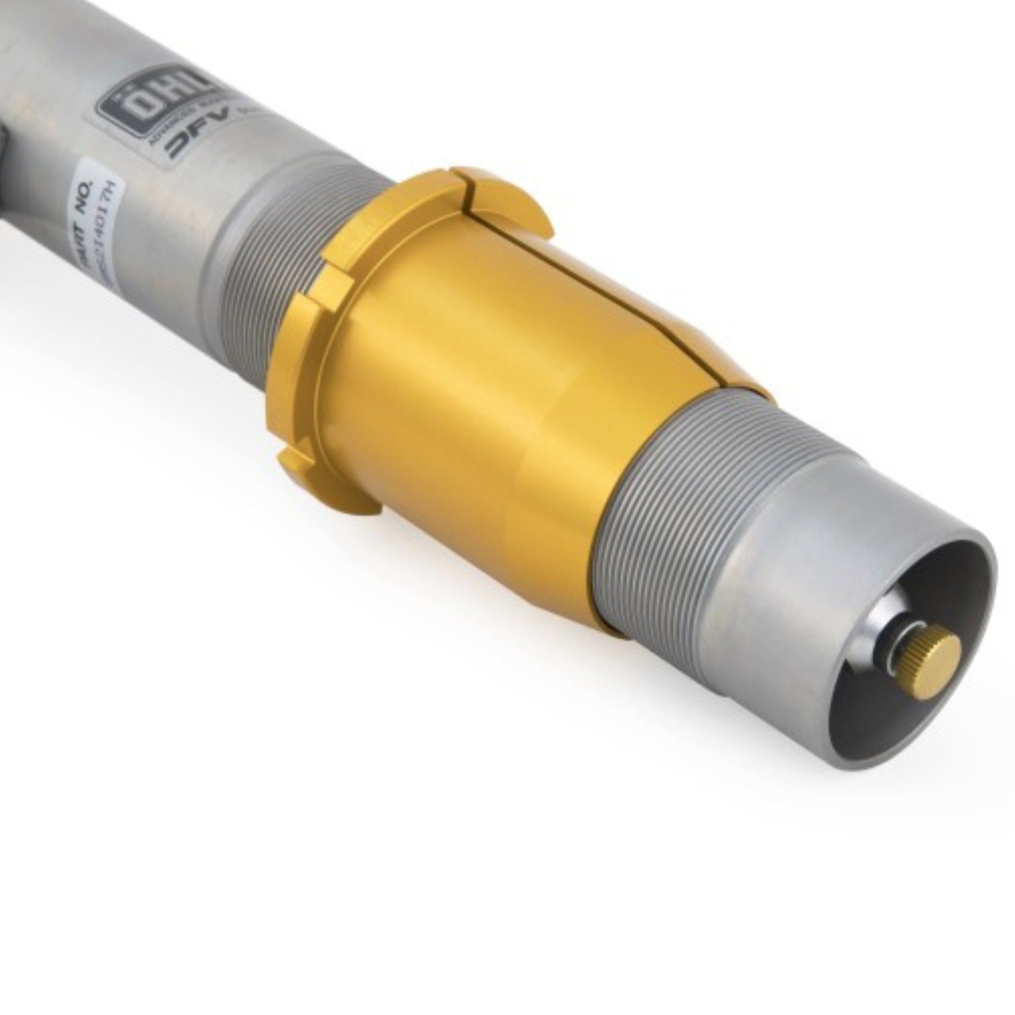 Close-up of a cylindrical tool with gold and gray sections on a white background