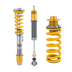 Three shock absorbers with yellow springs on a white background
