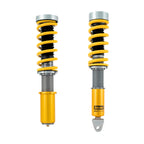 Ohlins Porsche Two yellow shock absorbers on a white background