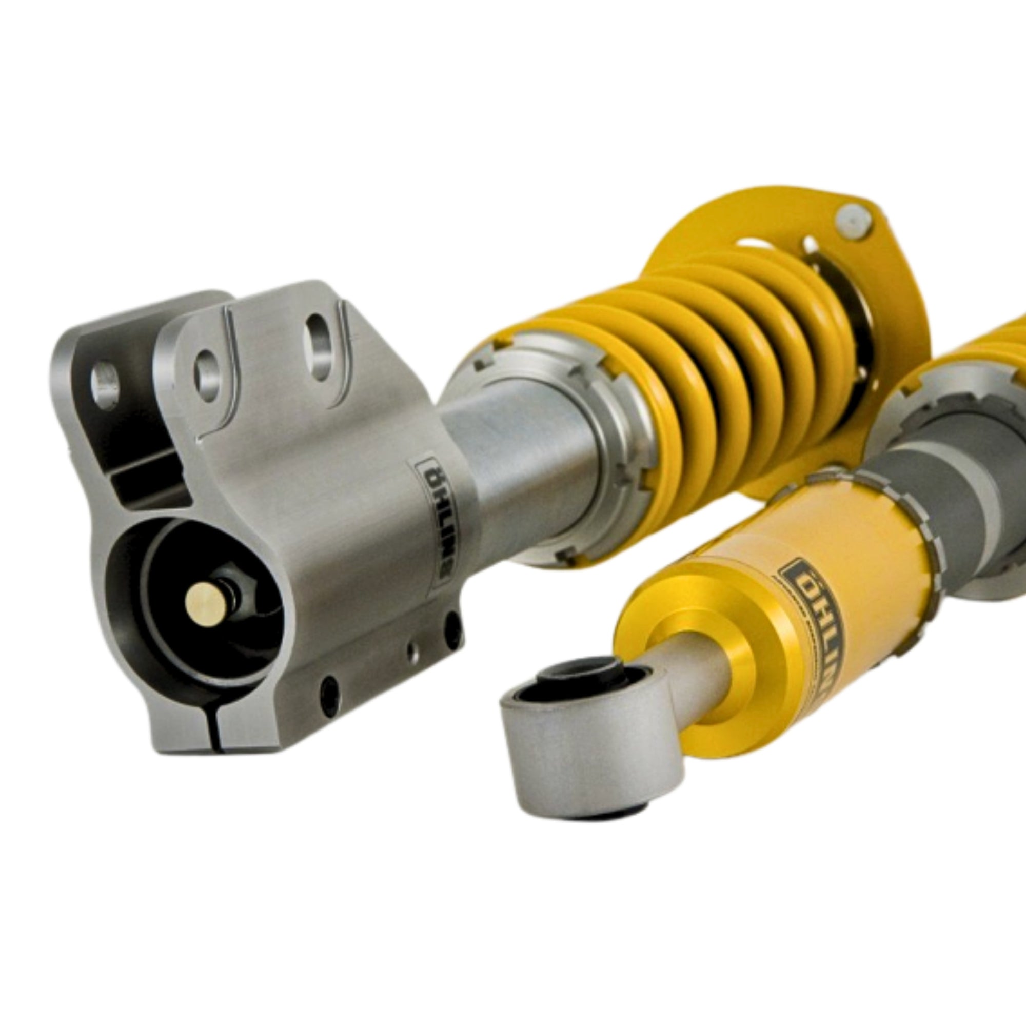 Yellow and silver ohlins shock absorbers on a white background