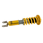 Ohlins Yellow shock absorber on a white background