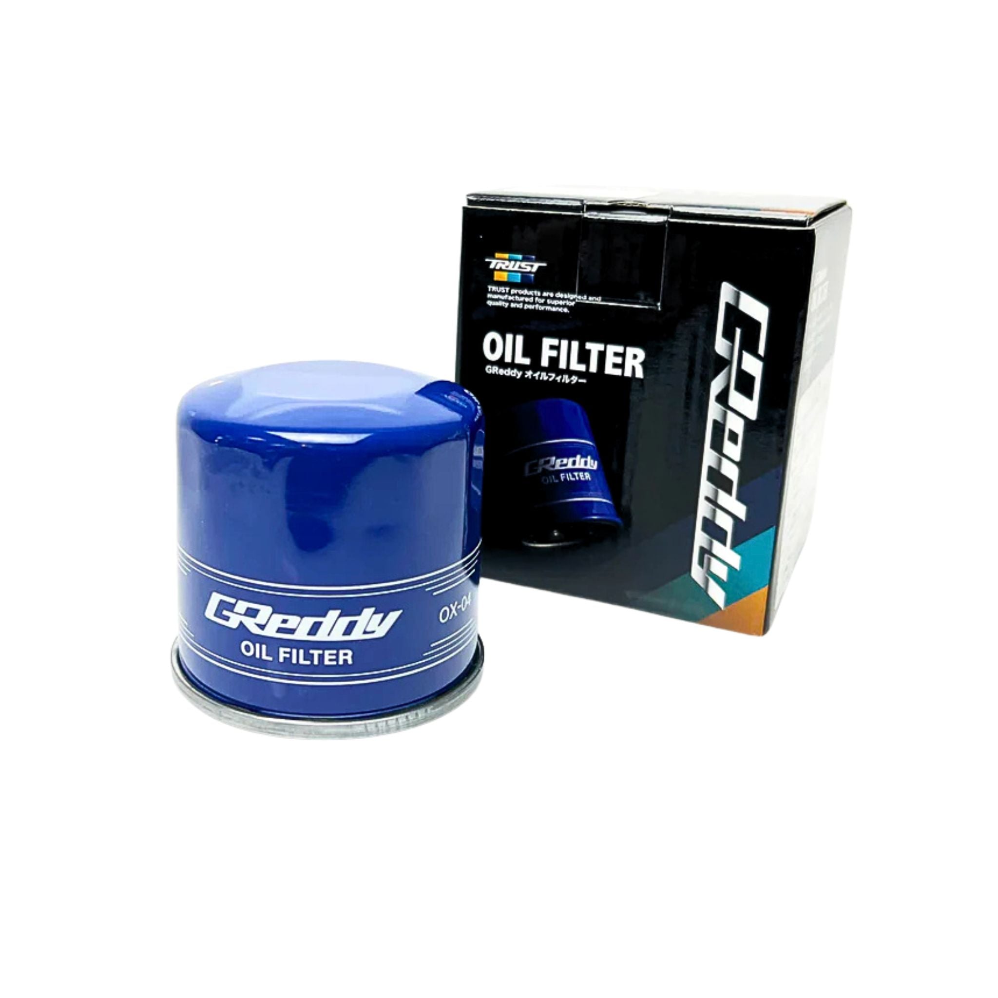 Blue oil filter with GReddy branding next to its packaging on a white background