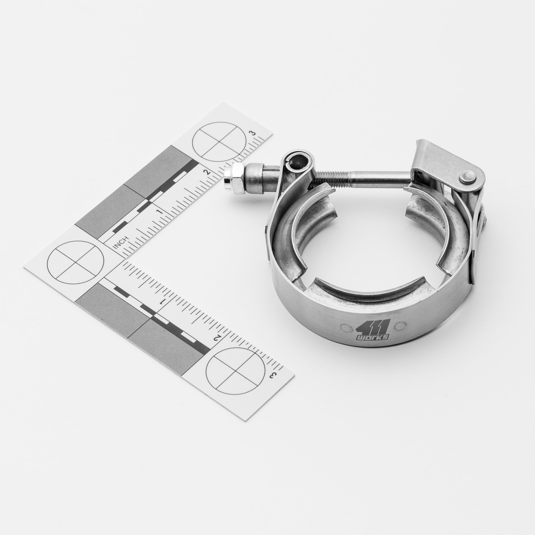 Metal T-bolt clamp with a ruler on a white background