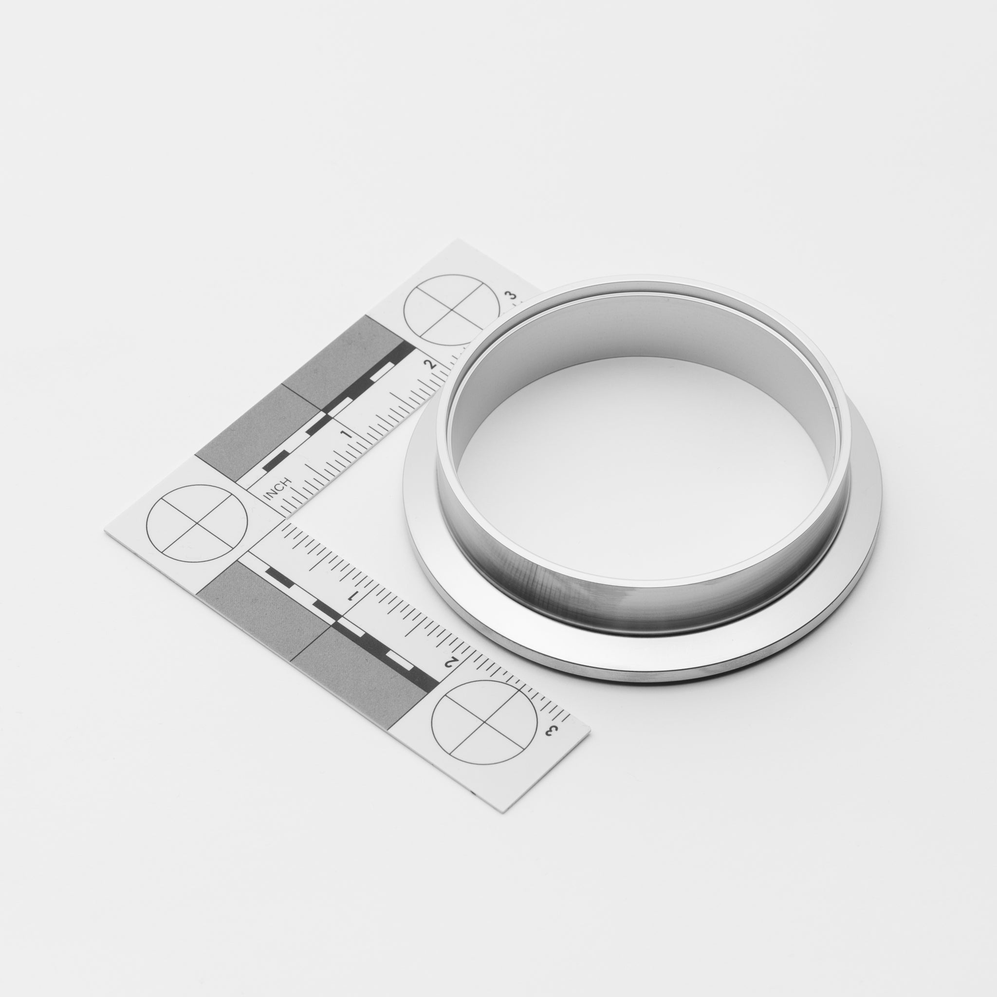 Silver V-Band Ferrule Male with a ruler for size measurement on a white background