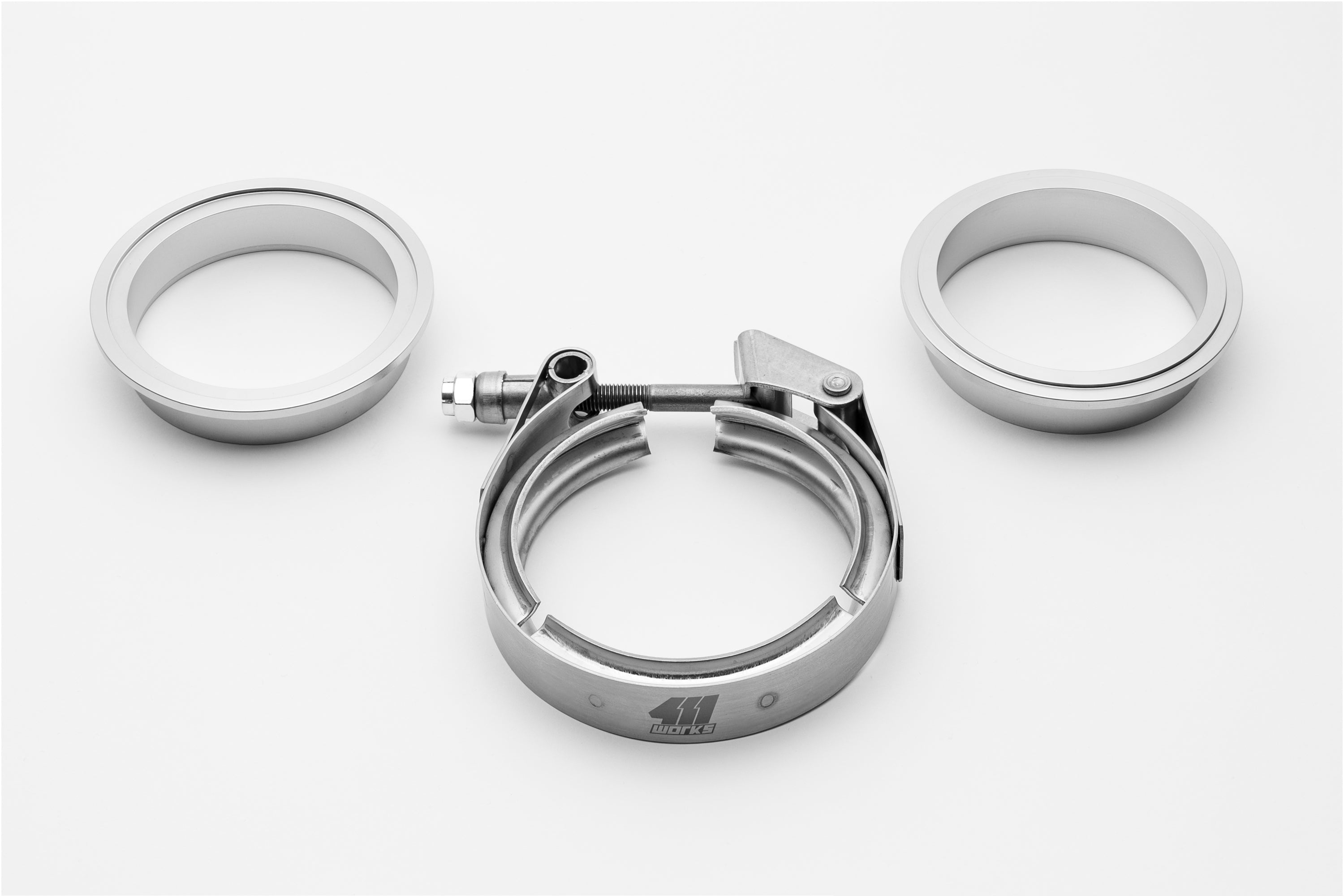 Metallic clamp with two circular components on a white background