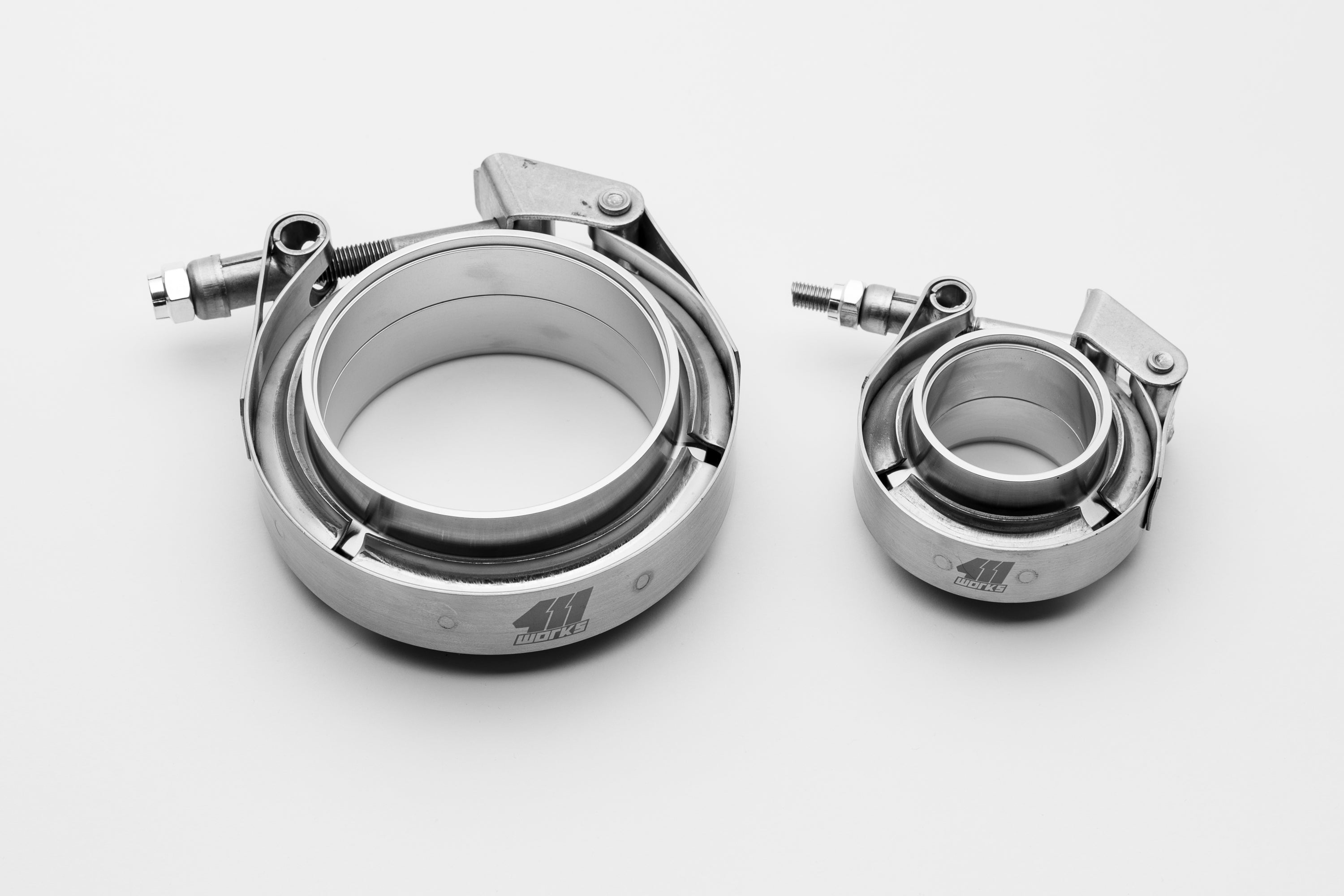 Two metal clamps on a white background