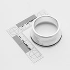 Silver welding transition cup with a ruler on a white background