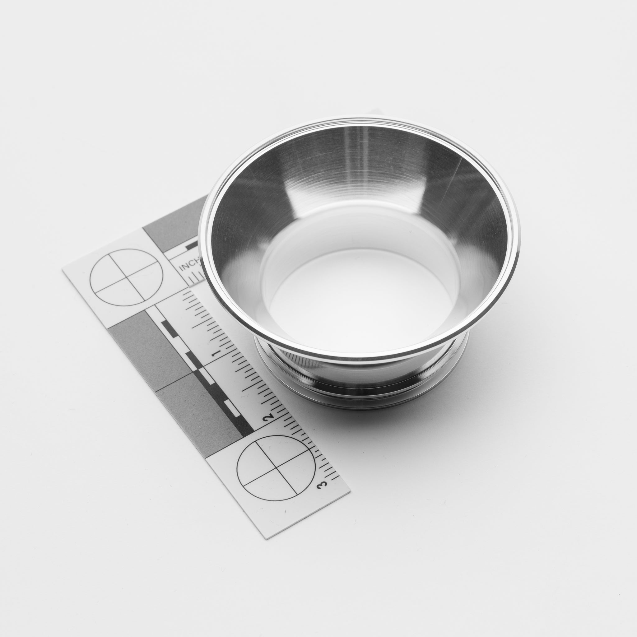 Stainless steel transition with ruler on a white background
