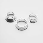 Three metallic rings on a white background