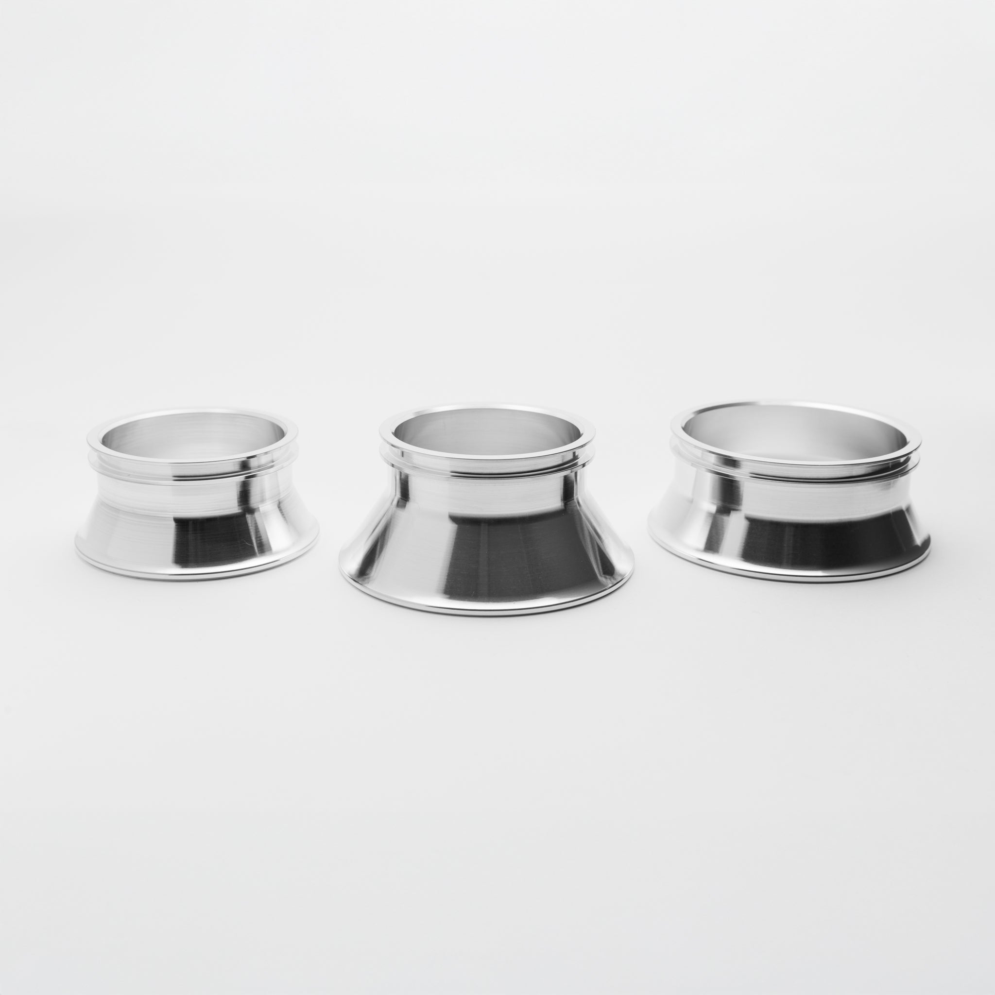 Three metallic reducer on a white background