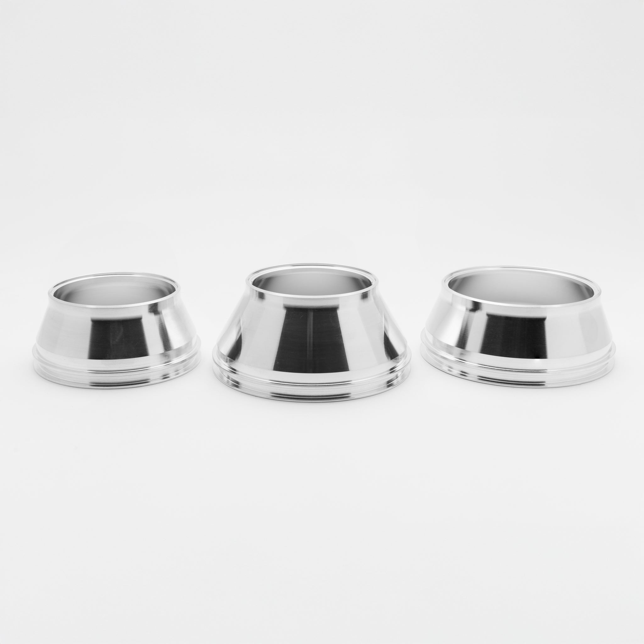 Three silver metal welding transitions on a white background