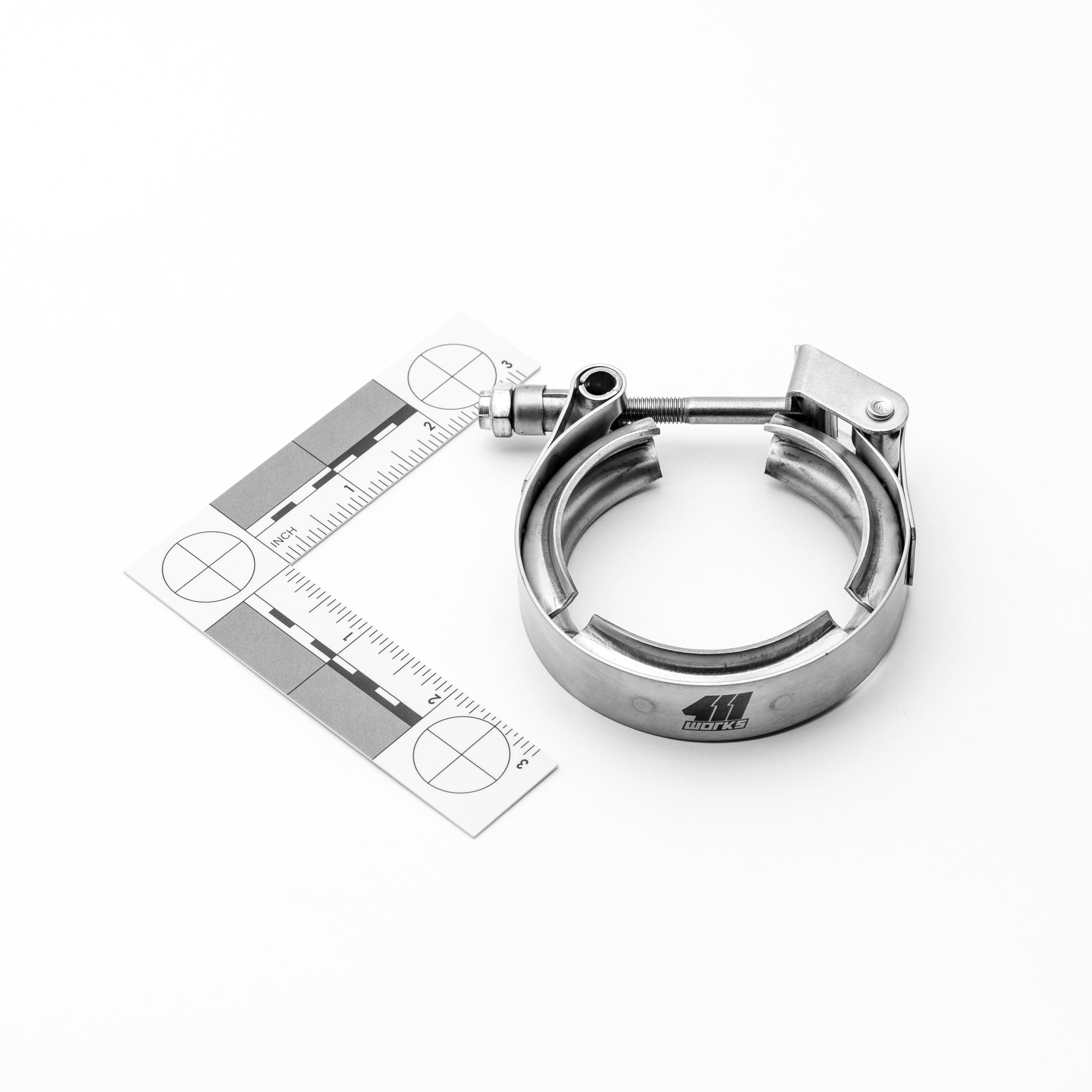 Metallic clamp with measurement scale on a white background