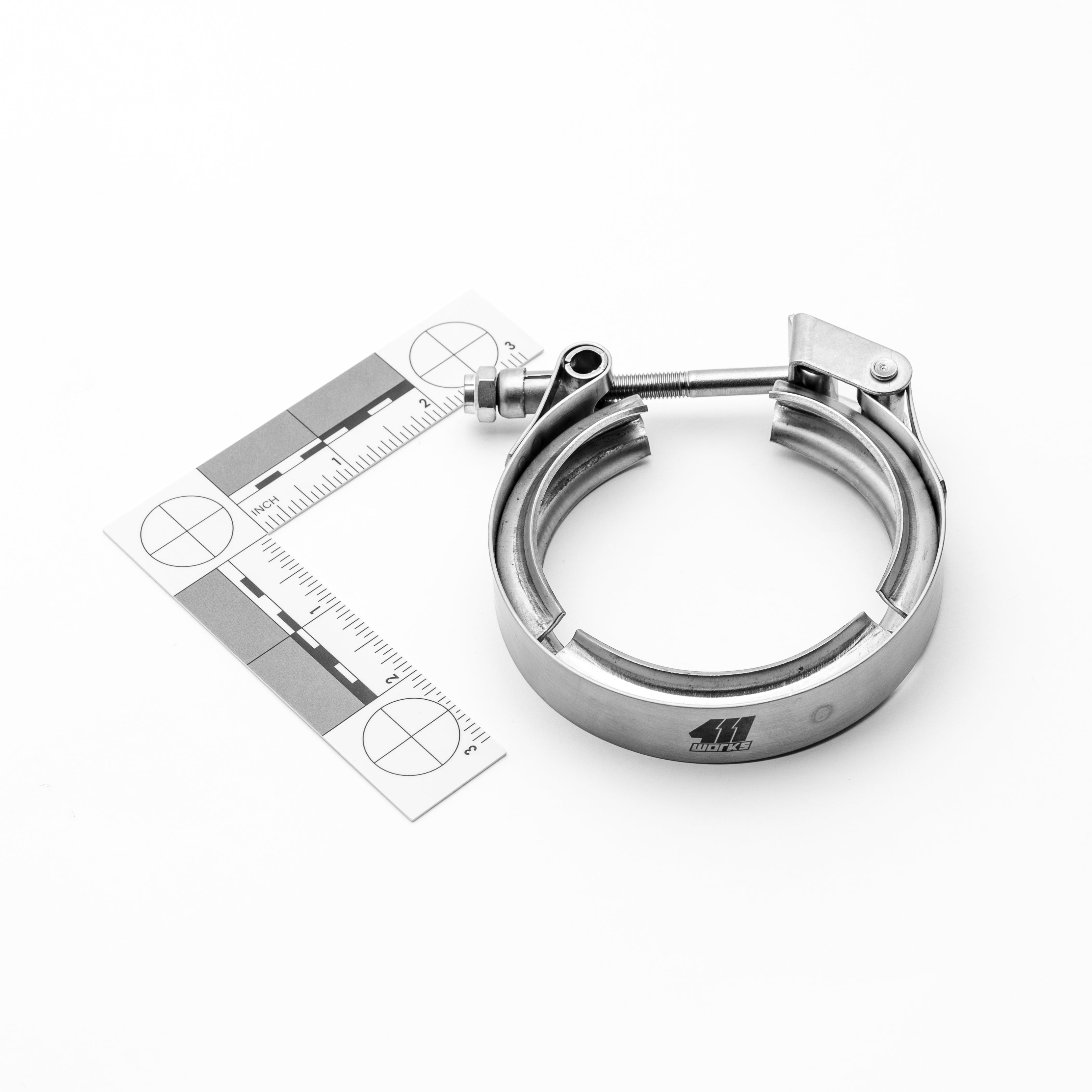 Metallic clamp with a ruler for size measurement on a white background