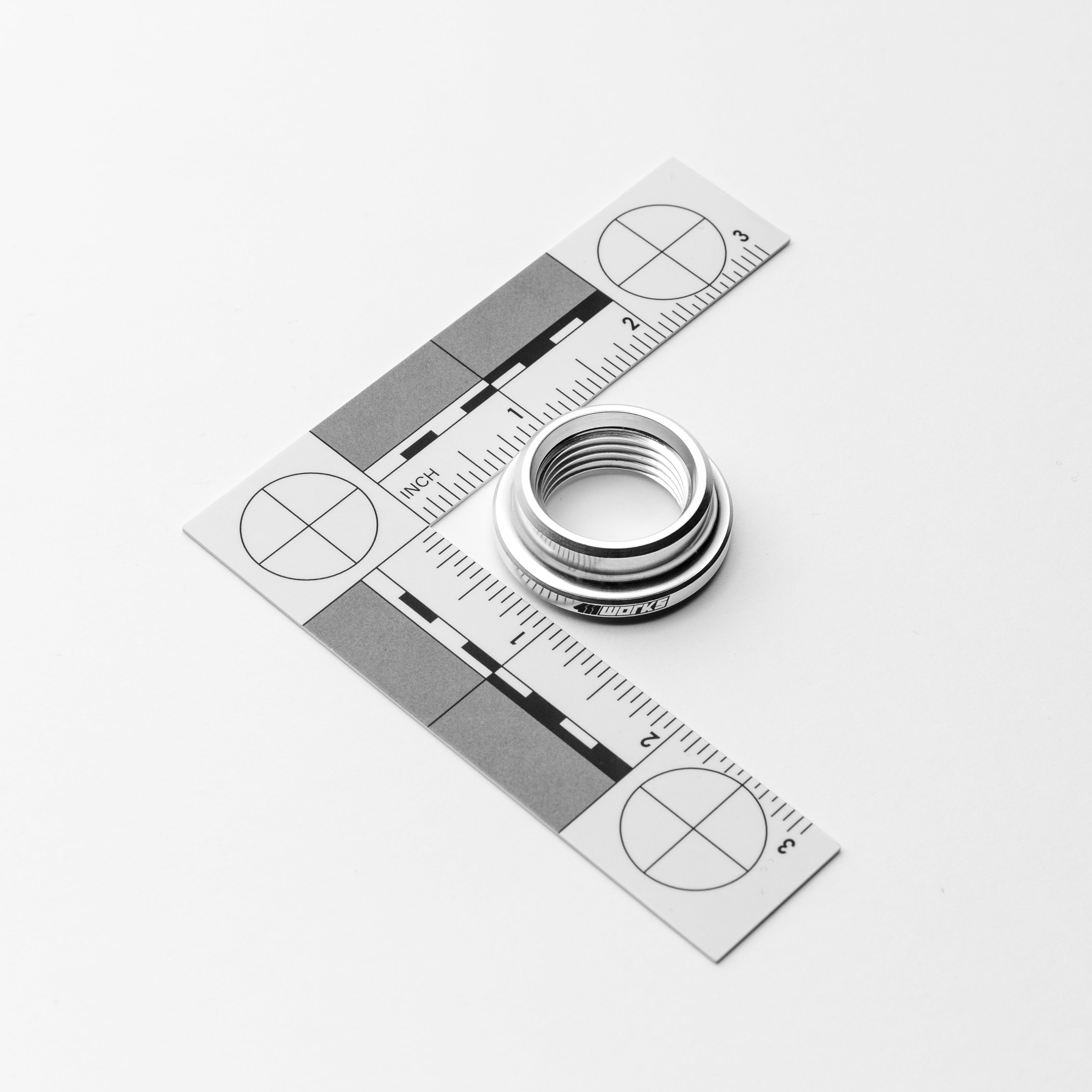 Metal ring with a scale ruler on a white background