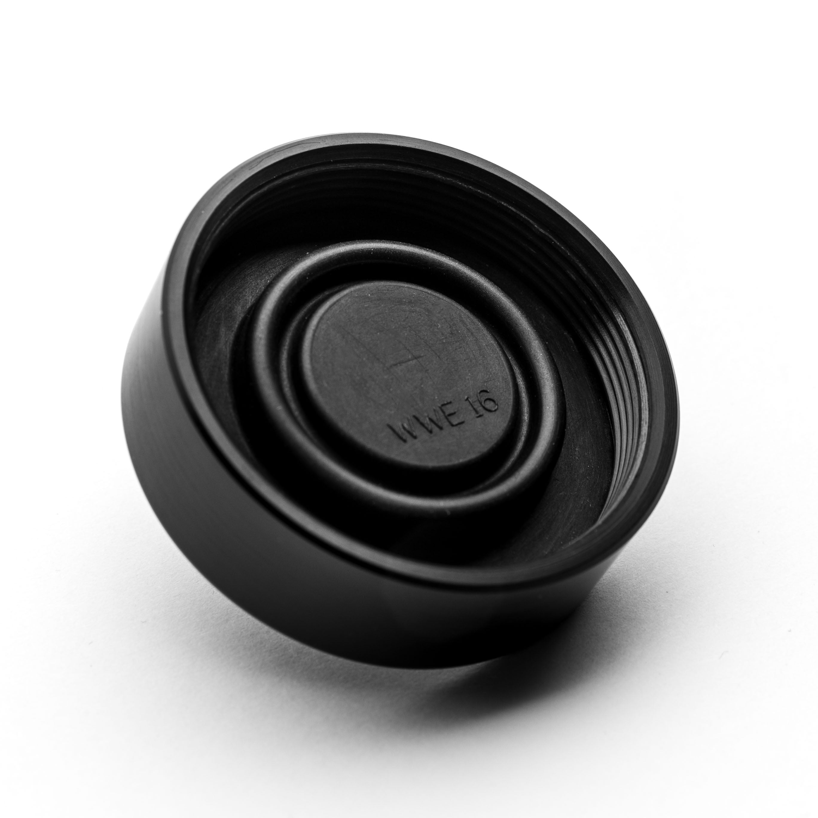 Black brake reservoir cap with branding on a white background