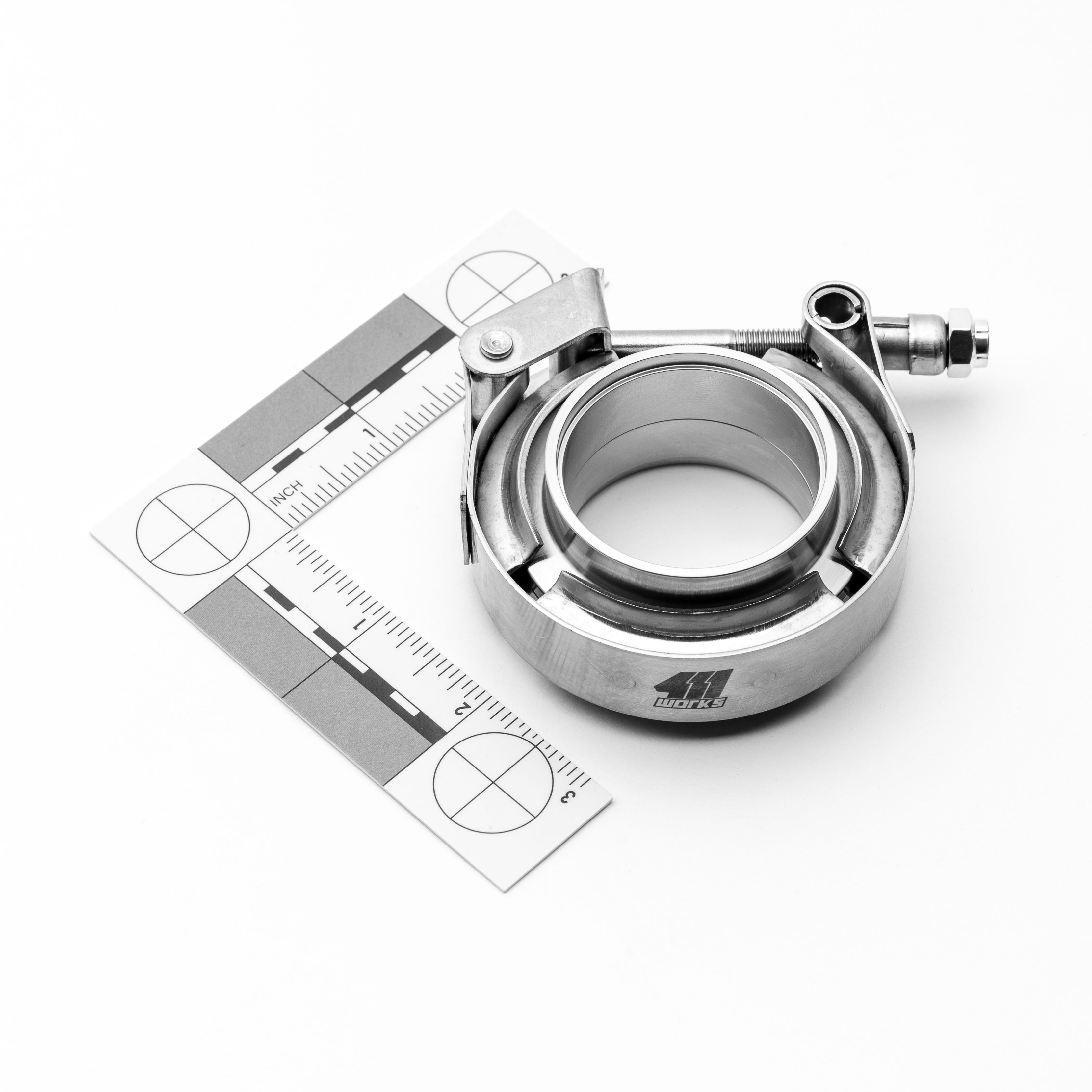 Metallic clamp with a ruler on a white background